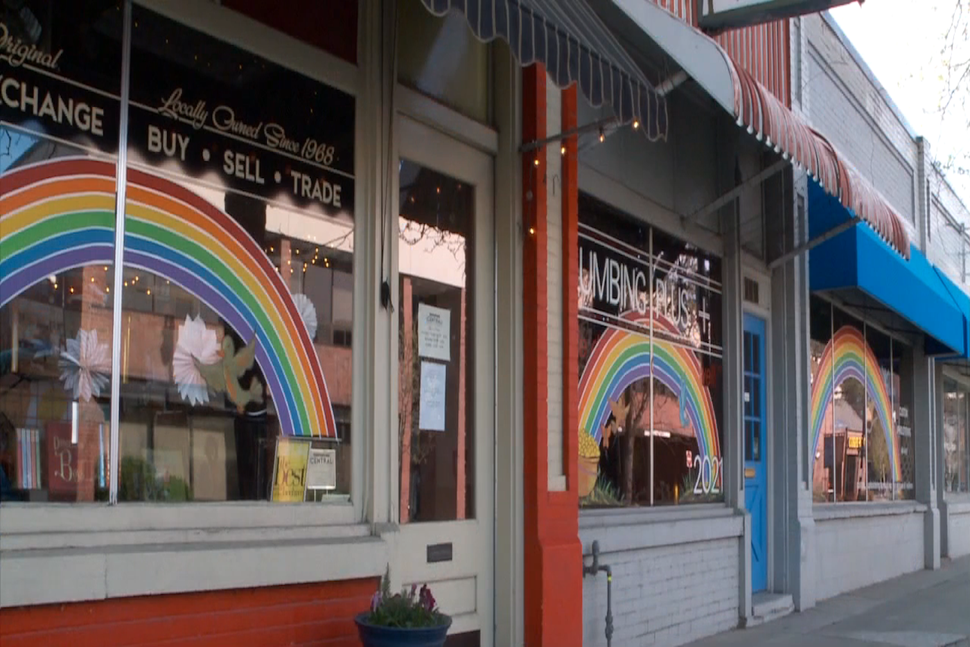 colorful window paintings on used bookstore storefront